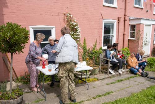 1024-029-Loraine-Aline-serving-cakes-teas-Loraine-Aline-serving-Pauline-outside-Ferry-House